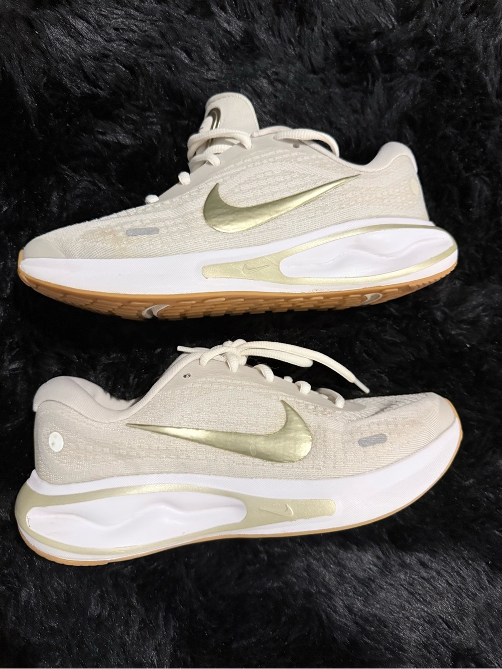 Nike Women's Cream Sneakers with Metallic Gold Swoosh